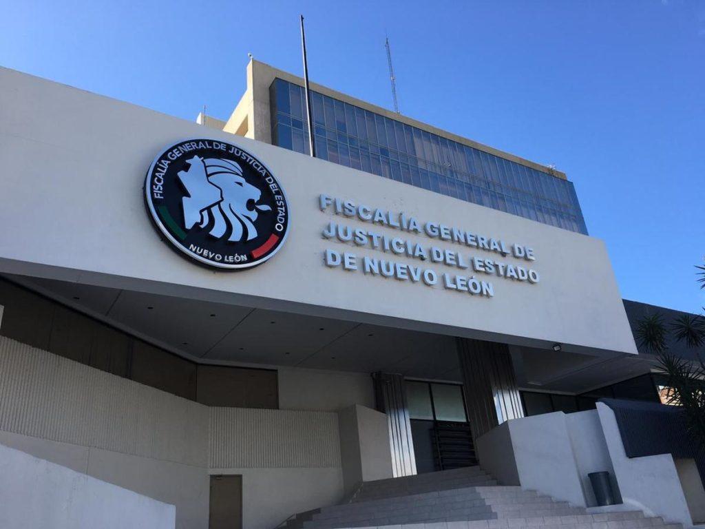 Facade of the Fiscalía General De Justicia Del Estado De Nuevo León Building with a Circular Seal on the Left and Large Raised Lettering on the Right. - Justicia Regia