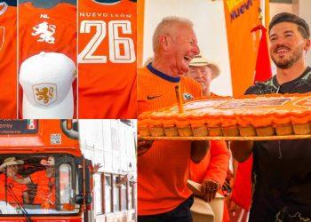 Fans in Orange Netherlands Jerseys Celebrate with a Large Orange Cake and Candles at a Festivity. - Justicia Regia
